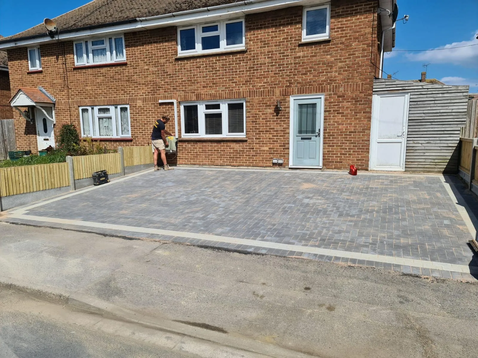 A brick paved driveway by Jackson Landscaping