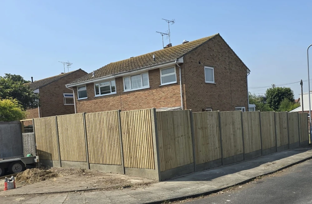 Six-foot wooden panel fencing installed by Jackson Landscaping