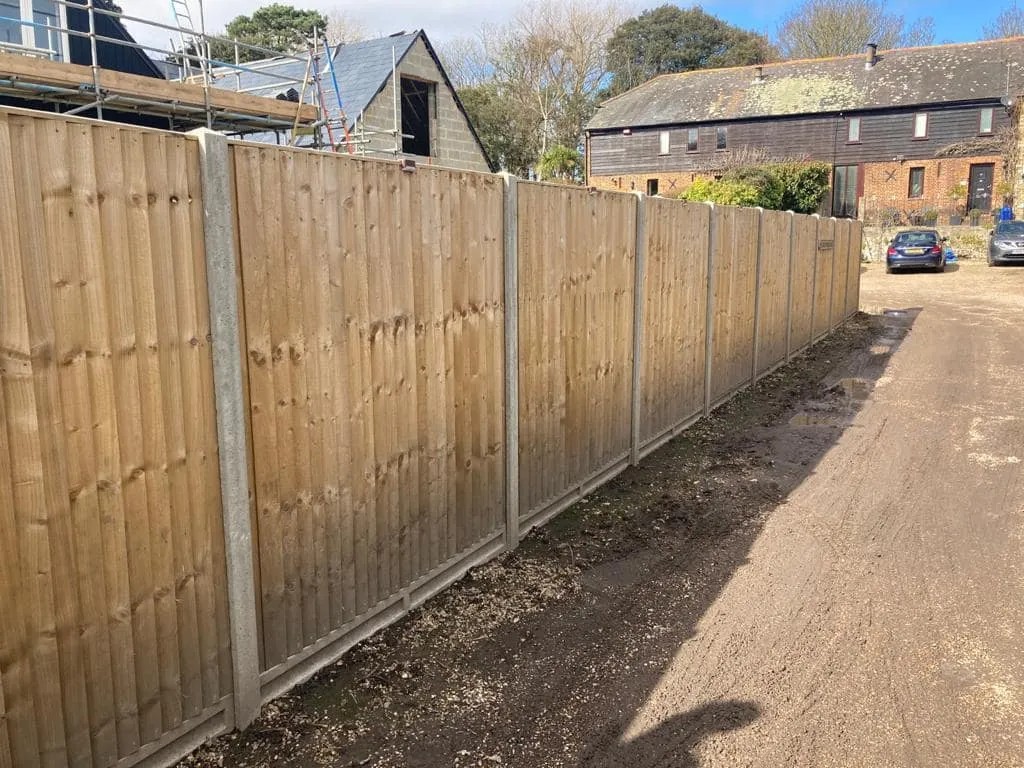 Privacy-enhancing six-foot wooden fencing professionally installed by Jackson Landscaping