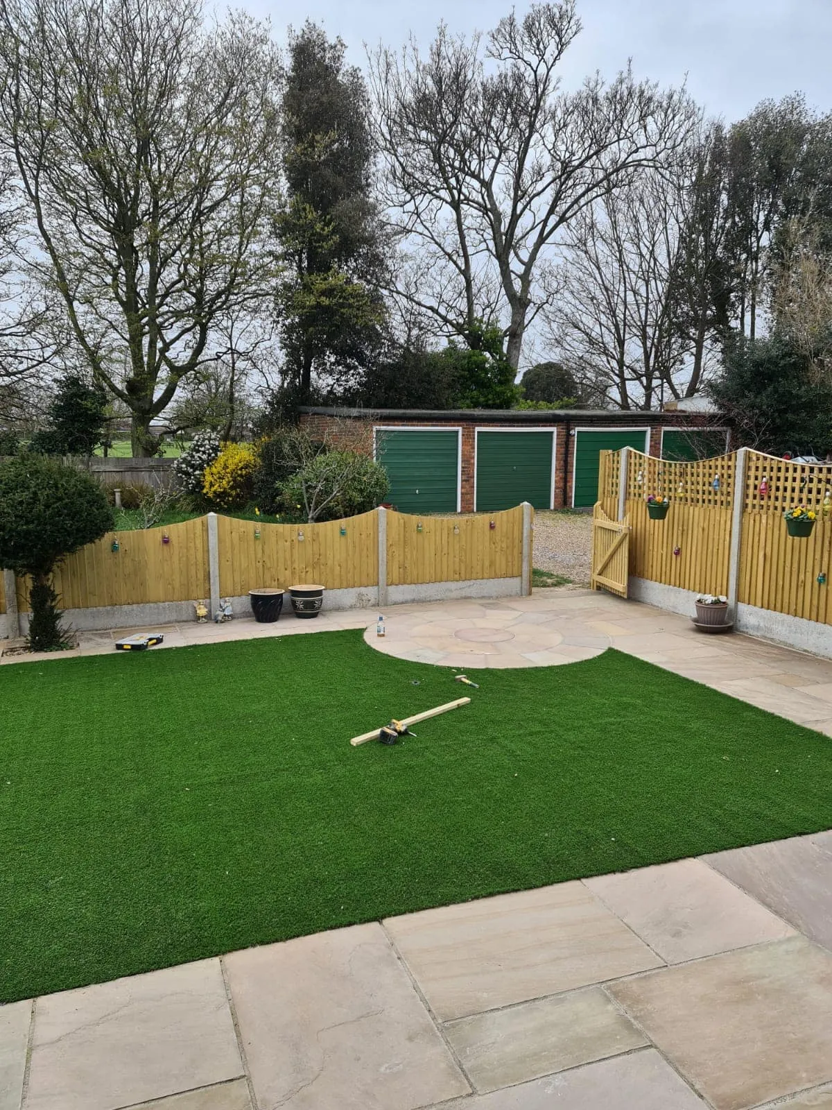 Durable and stylish wooden panel fencing by Jackson Landscaping.